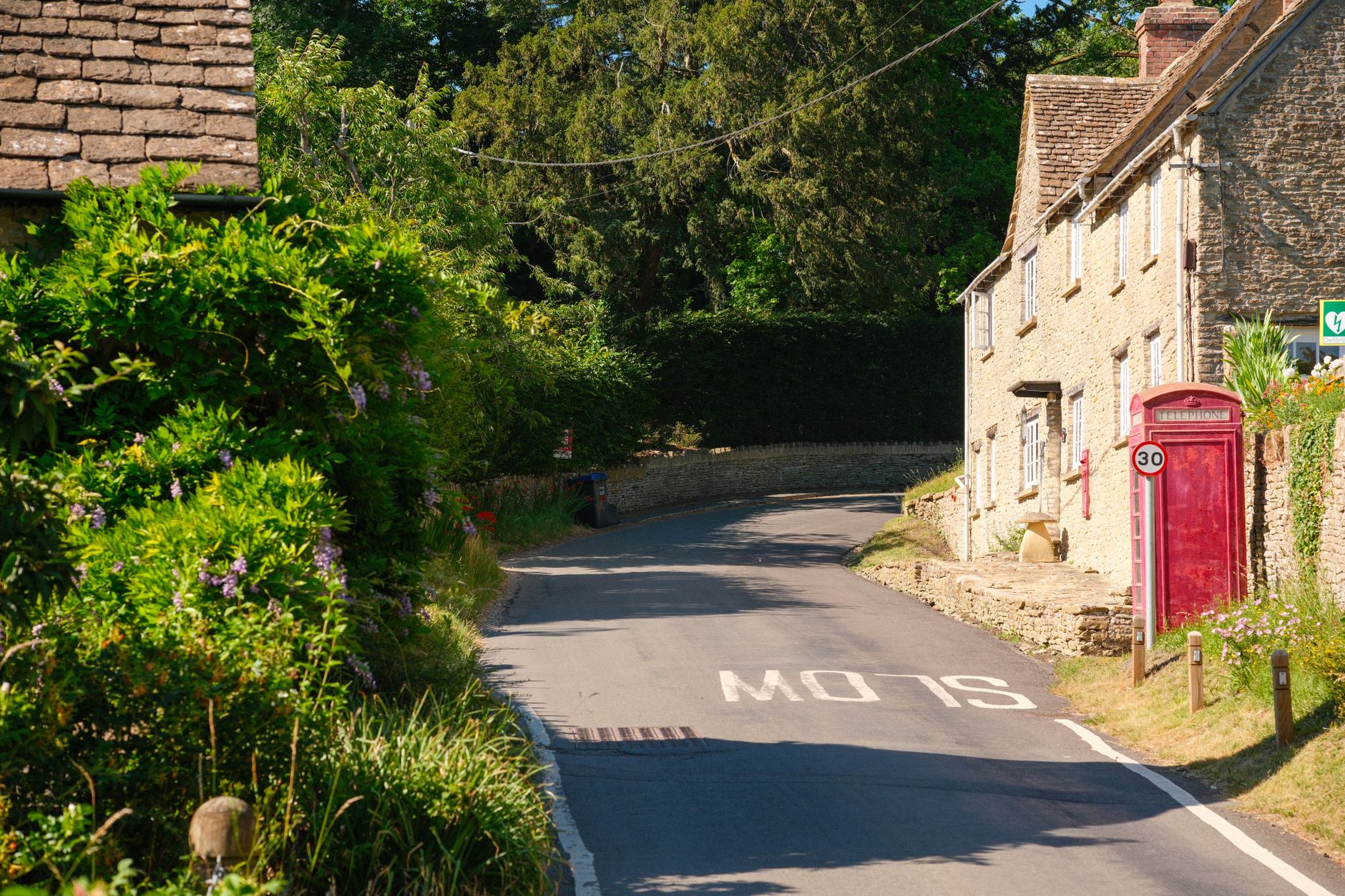 A Georgian tollhouse beside an old English road, illustrating turnpike trusts history in England