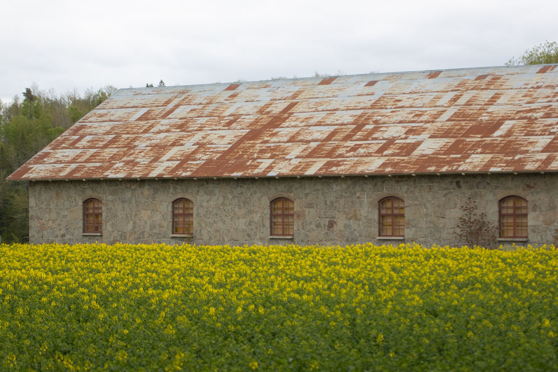 Interior of a medieval stone tithe barn illustrating tithe barn history in England
